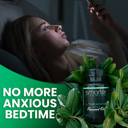 Woman staying at phone in bed, No more anxious bedtime with Smarter L-Theanine