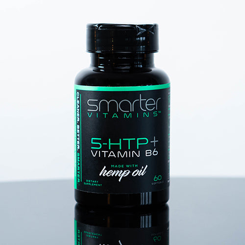 Smarter HTP + Vitamin B6 made with hemp oil, bottle on a black reflective table.