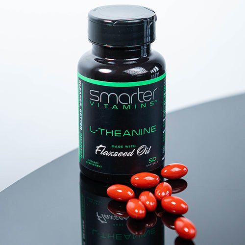 Smarter L-Theanine on a black reflective table with L-Theanine supplements surrounding the bottle.