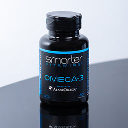 Bottle of Smarter Omega-3 on a reflective table Randy Jabero